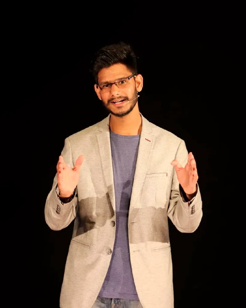 Gautam Kumawat reading case material from a tablet